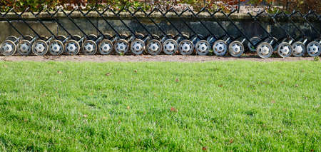 7 November 2020 - England: Row of unused golf trolleys with copy space on grassのeditorial素材
