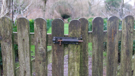 Garden gate in winter with rusty bolt with space for copy