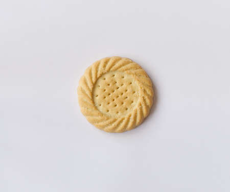 Single sugared shortcake biscuit on white background with copy spaceの写真素材