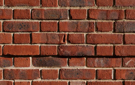 Full frame image of weathered old brick wall with copy spaceの写真素材