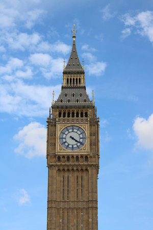11 September 2022 - London UK: Vertical image of Big Ben against blue autumn sky
