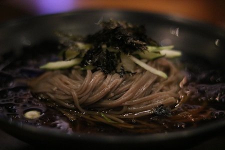 South Korean culinary dish of buckwheat noodles served with vegetablesの写真素材