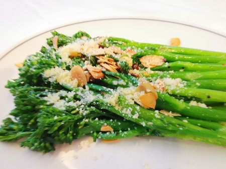 Healthy snack or meal of green broccoli with almonds and parmesan cheeseの写真素材