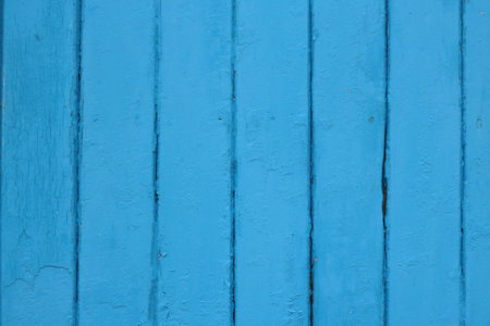 Weathered blue panelled wood with peeling paint and space for copyの写真素材