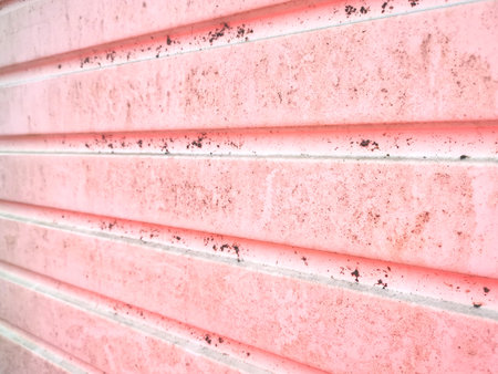 Grunge soft pink horizontal panelled background with space for copyの写真素材