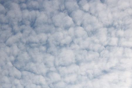 Full frame of pretty blue sky with unusual scudding cloud formation