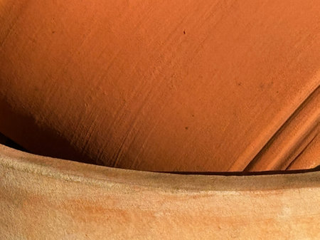 Image of close up of large stacked terracotta potsの写真素材
