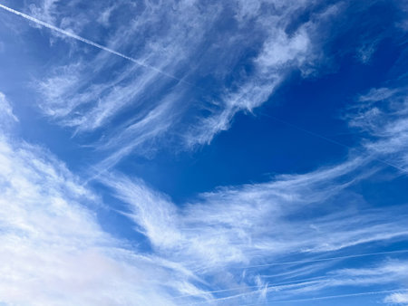 Full frame of pretty blue sky with unusual scudding cloud formationの写真素材