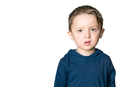 Close up portrait of a surprised european baby boy looking at camera