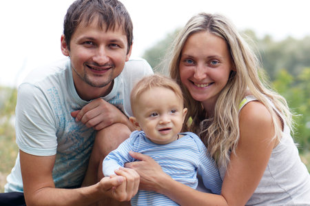 parents with baby in park