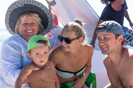 Happy parents and child having fun spending time together on a beach. Little baby boy. Happy family....