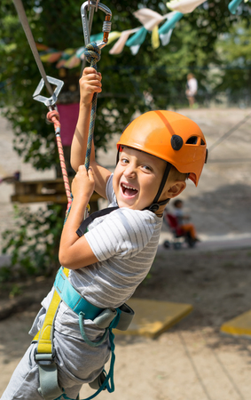 Boy at climbing activity in high wire forest park. Table Mountain Cableway kids special on again.の写真素材