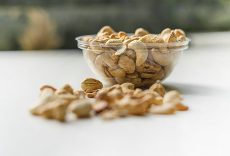 Healthy food  for background image close up cashew nuts.  Nuts texture on white grey table top view...