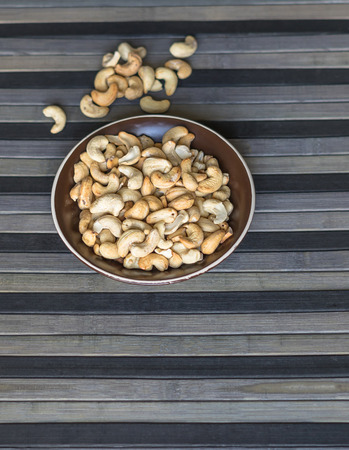 Healthy food  for background image close up cashew nuts.  Nuts texture on top view on the cup plateの写真素材