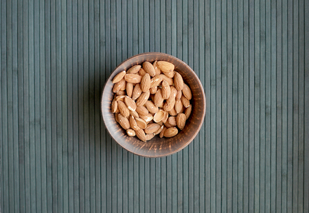 Healthy food  for background image close up almond nuts. Texture Nuts on the cup plateの写真素材