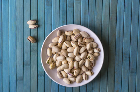 Healthy food  for background image close up pistachios nuts. Texture on top view Nuts pistachio on...