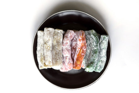 Traditional Turkish Delight. Oriental dessert on a  plate. Isolated on white background. Eastern delicacy sweets. Healthy food mix assortment. Collection of different for image close up top viewの写真素材