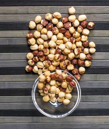 Healthy food  for background image close up hazelnuts.  Nuts texture on top view on the cup plateの写真素材