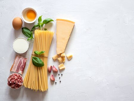 Fresh raw ingredients for traditional italian pasta Carbonara. Top view, copy spaceの写真素材