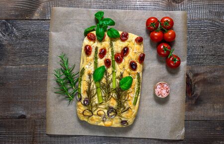 Trendy art garden Focaccia bread. wooden table, top view, copy spaceの写真素材