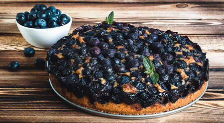 Homemade blueberry pie on the wooden tableの写真素材