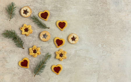 Traditional Austrian Christmas cookies - Linzer biscuits filled with red berry jam. Flatlay with copy space.の写真素材