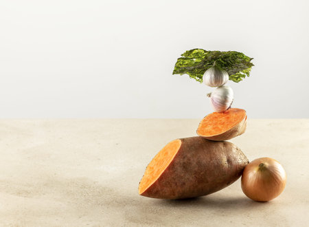 Balancing prebiotic foods on the table, creative healthy concept. Sweet potato, garlic, seaweed, and...