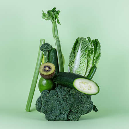 Fresh green vegetables and fruits for a healthy smoothie or alkaline diet. Equilibrium floating food balance.の写真素材