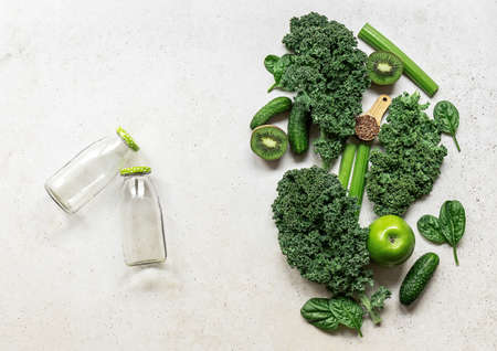 Ingredients for a healthy green smoothie or salad - superfoods, detox, alkaline diet, health, vegetarian food concept. Background layout with free text space.の写真素材