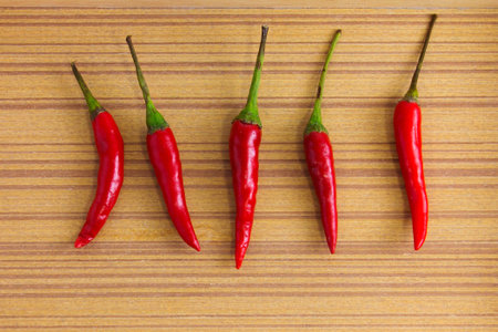 chili on wood background