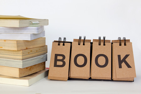 book stack with wording "Book" on white backgroundの写真素材