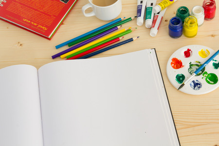 painting equipment and paper on wood tableの写真素材