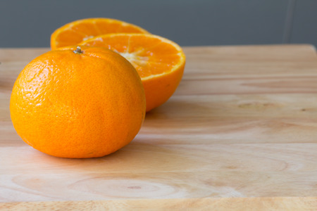 orange juicy fruit on wood tableの写真素材