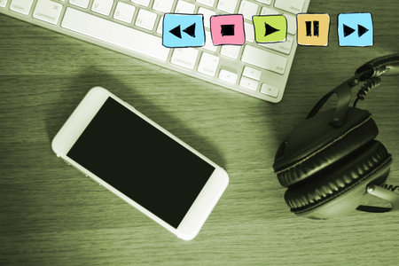 Music Player Buttons drawing with Music listener online concept ,Stereo headphones ,mobile phone and...