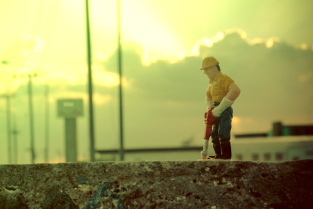 small figure of a man digging groundの写真素材