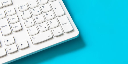 computer keyboard pad on blue background , minimal styleの写真素材