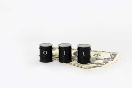 oil tanks with money , oil price crisis conceptの写真素材