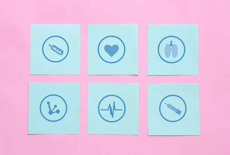 healthcare and medical icon on paper , medical examination , healthcare service quality conceptの写真素材