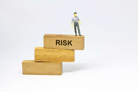 businessman step on structure of wood blocks, risk management conceptの写真素材