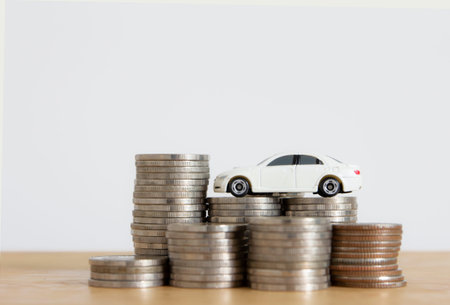 toy car on stack of coins , car loan concept