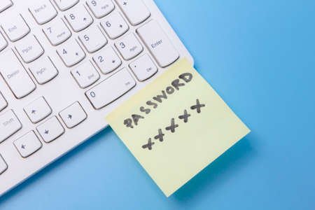 note paper of password key sticked on keyboard computer, security password managementの写真素材