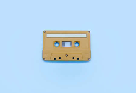 yellow tape cassette on blue backgroundの写真素材