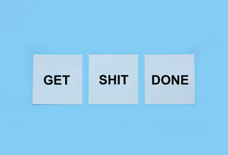 Get shit done message on papersの写真素材