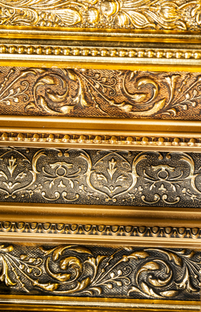 Full frame texture form old golden ornamental picture framesの写真素材