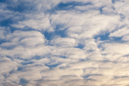 Small fluffy clouds on blue sky.の写真素材