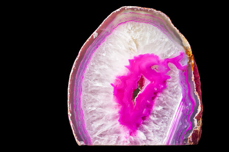 Pink and purple Agate crystal cut isolated on black backgroundの写真素材