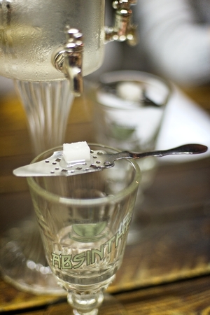 Classic ritual of glass of absinth and dripping fountain.の写真素材