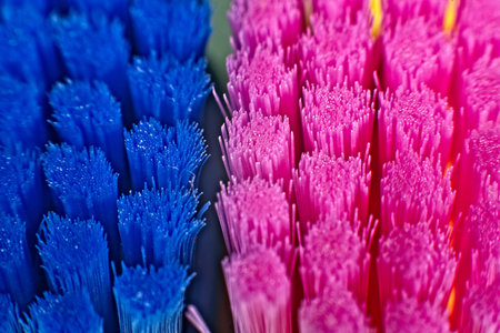 Close up of colorful professional soft toothbrushes with lot of bristles in straight cut.