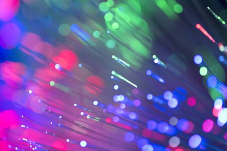 Blured bright and dark colorful background - selective focus photo of fiber optics led light.の写真素材