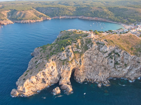 Aetial view of Torre de MontgÃ³ tower and and caves near MontgÃ³ cliff in town L'Escala, Catalonia, Spain.の写真素材